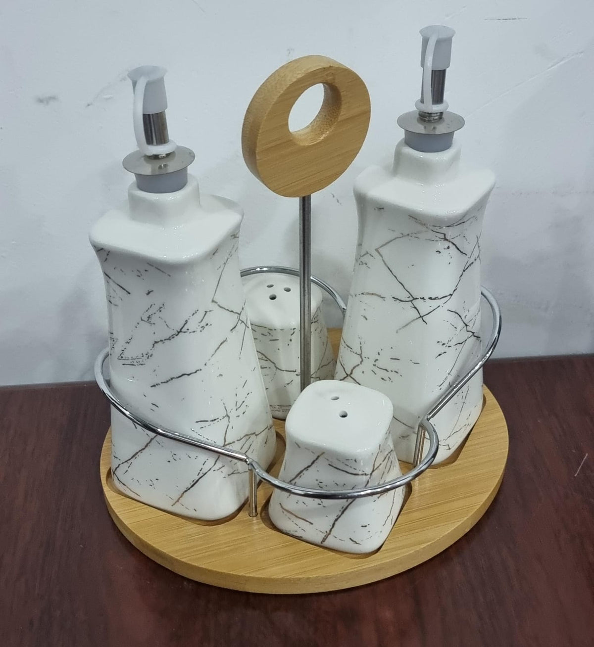 set of 4 ceramic gravy boat season oil dispenser and shakers on bamboo base