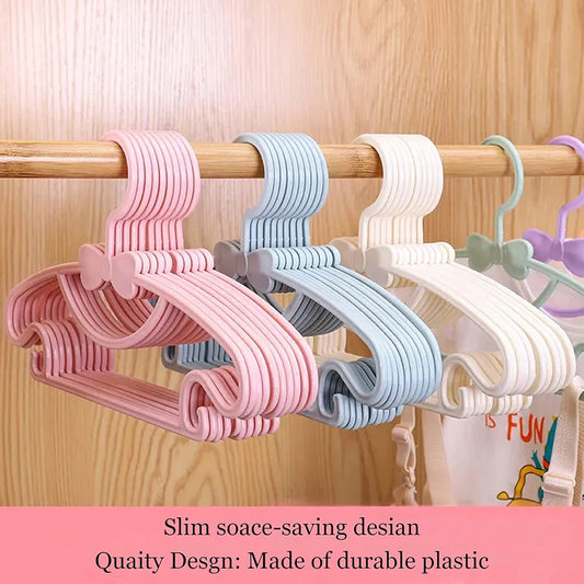 Pastel-colored plastic kids clothes hangers.