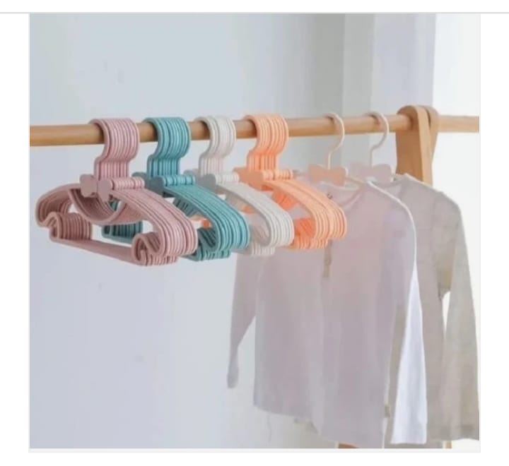 Pastel-colored plastic kids clothes hangers.
